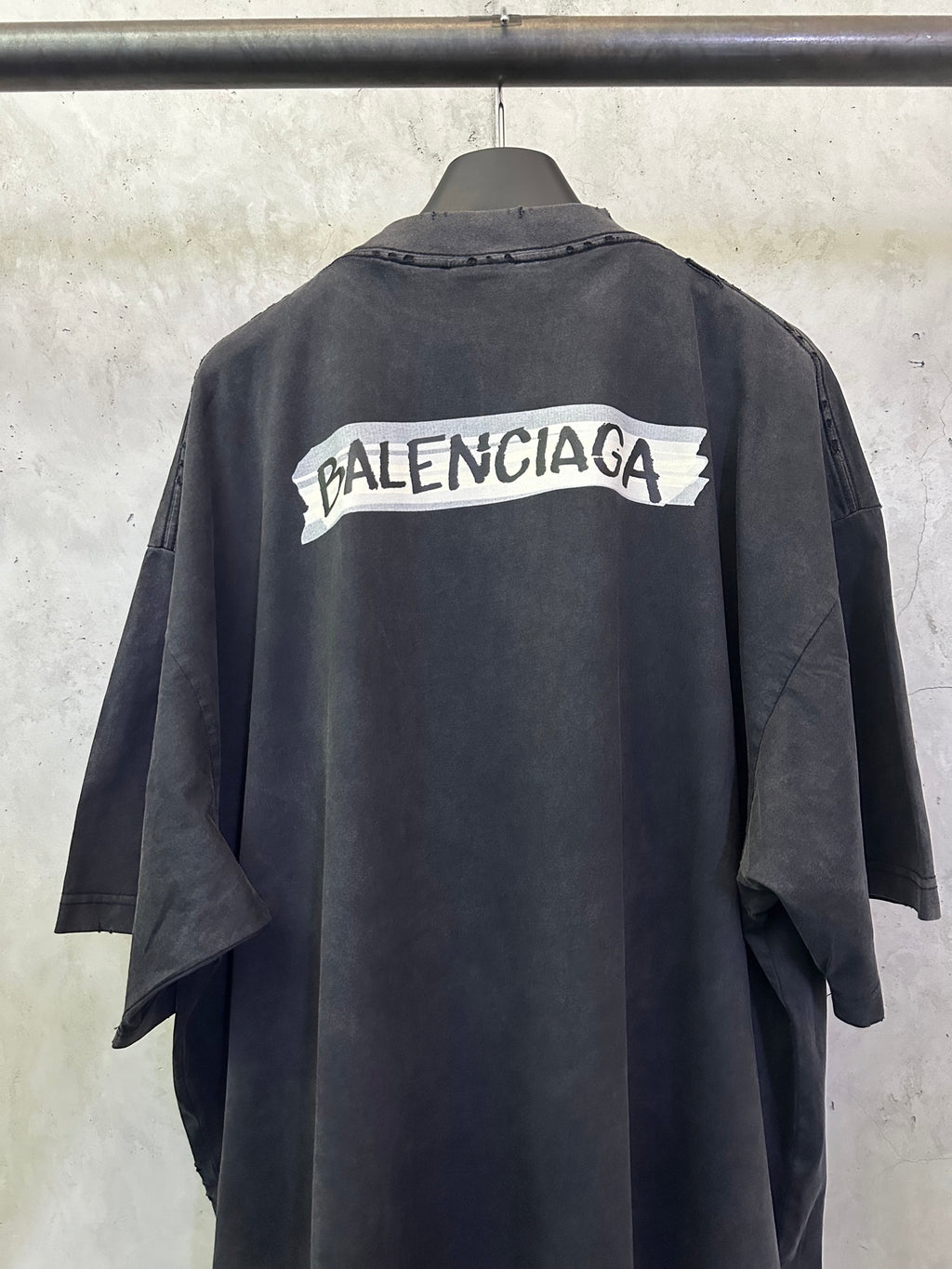 Black Balenciaga T-shirt back view with Balenciaga logo print across the upper back