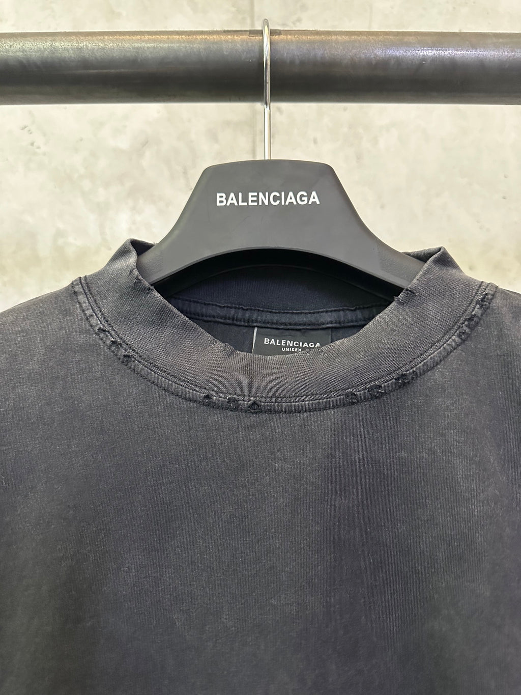 Black Balenciaga T-shirt neckline detail with inner brand label and crew collar stitching