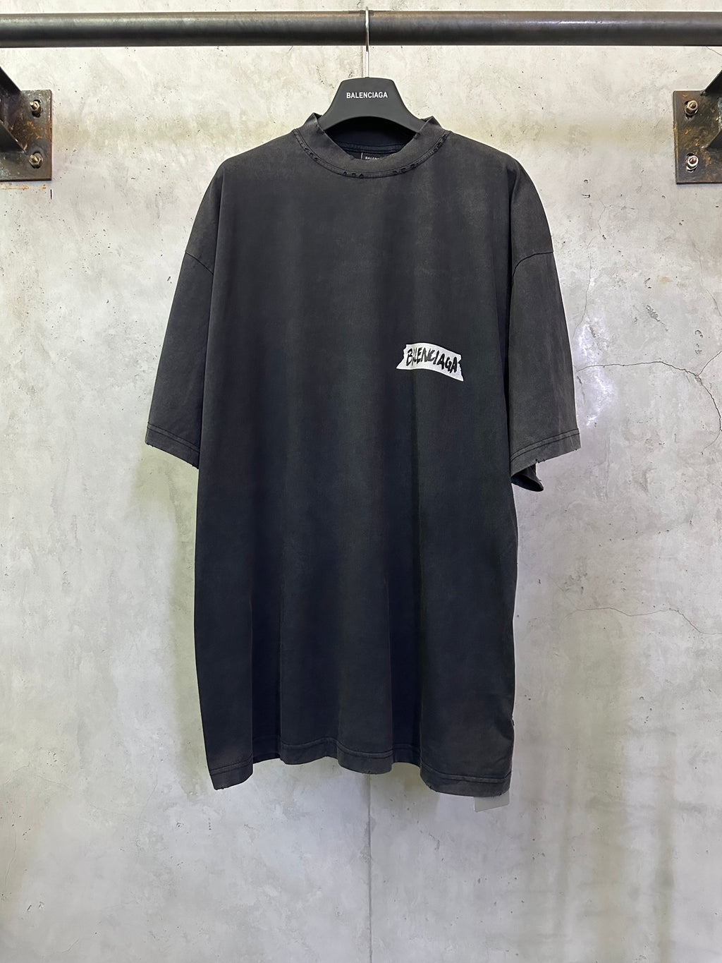 Dark charcoal short-sleeve T-shirt with Balenciaga logo patch at chest