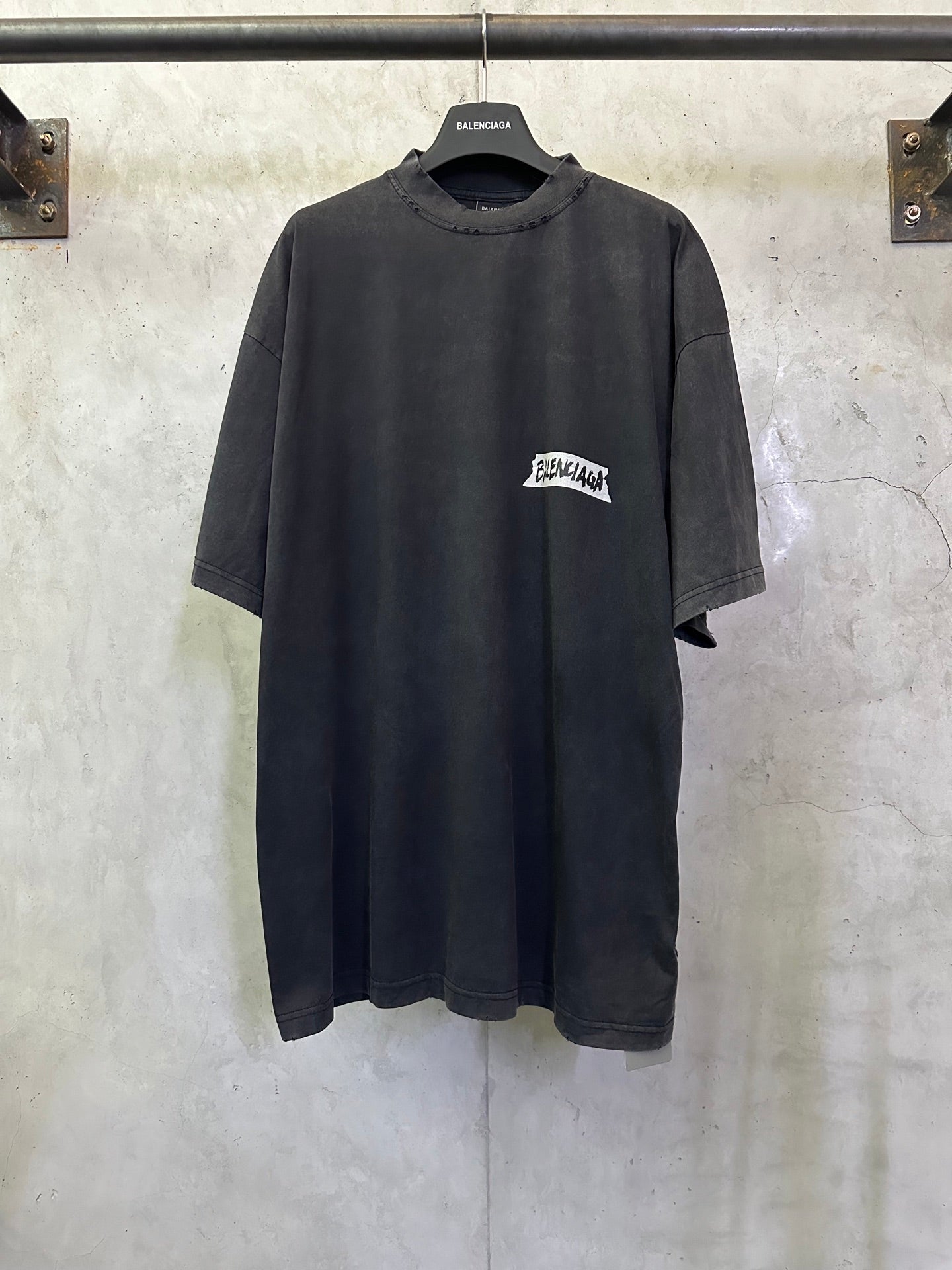 Dark charcoal short-sleeve T-shirt with Balenciaga logo patch at chest