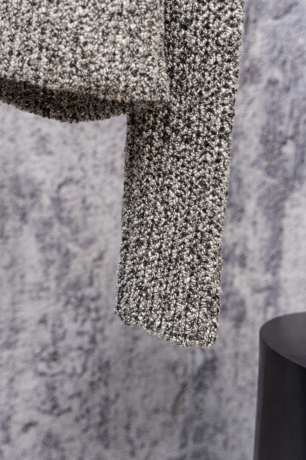 Stone Island speckled knit jacket sleeve hem, close-up