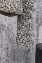 Stone Island speckled knit jacket sleeve hem, close-up