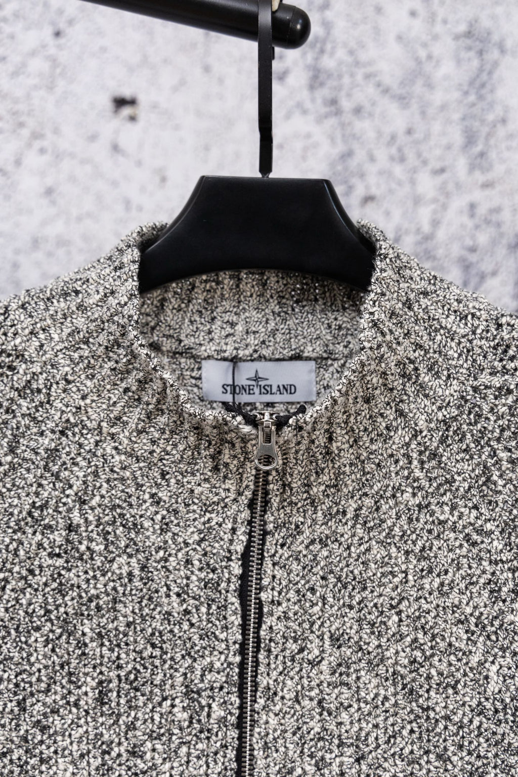 Speckled knit zip jacket with black stand collar and center zipper