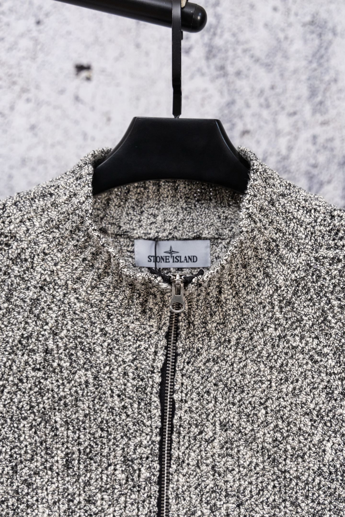 Speckled knit zip jacket with black stand collar and center zipper