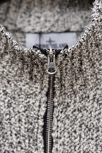 Stone Island speckled knit jacket zipper and pull tab, close-up