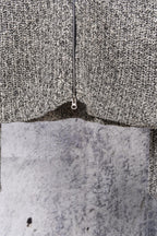 Stone Island speckled knit jacket hem and side seam, close-up