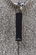 Stone Island speckled knit jacket with black Stone Island label tag, close-up