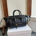 Celine handbag in dark leather with top handles, front flap pocket, and crossbody strap