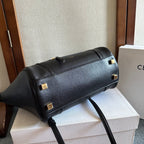 Celine leather handbag with gold-tone buckles and a long top-zip opening