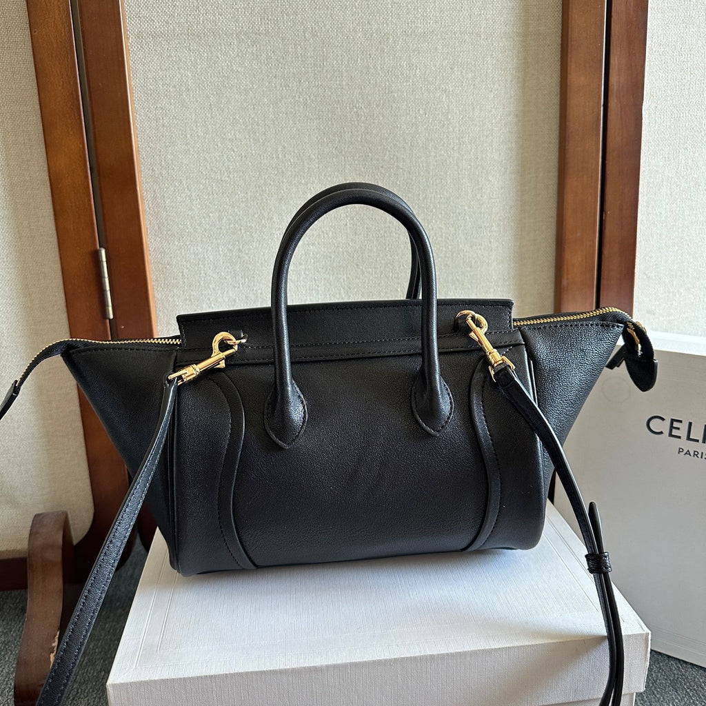 Celine handbag in dark leather with top handles, front zipper pocket, and crossbody strap