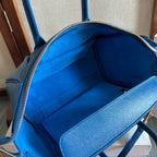 Blue leather bag interior lining with zippered opening and side pocket