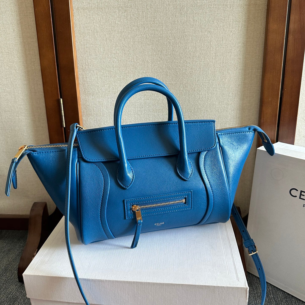 Celine blue leather top-handle bag with front flap and gold zipper detail