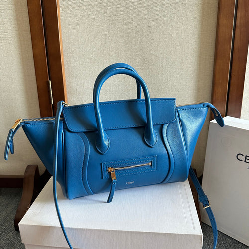 Celine blue leather top-handle bag with front flap and gold zipper detail