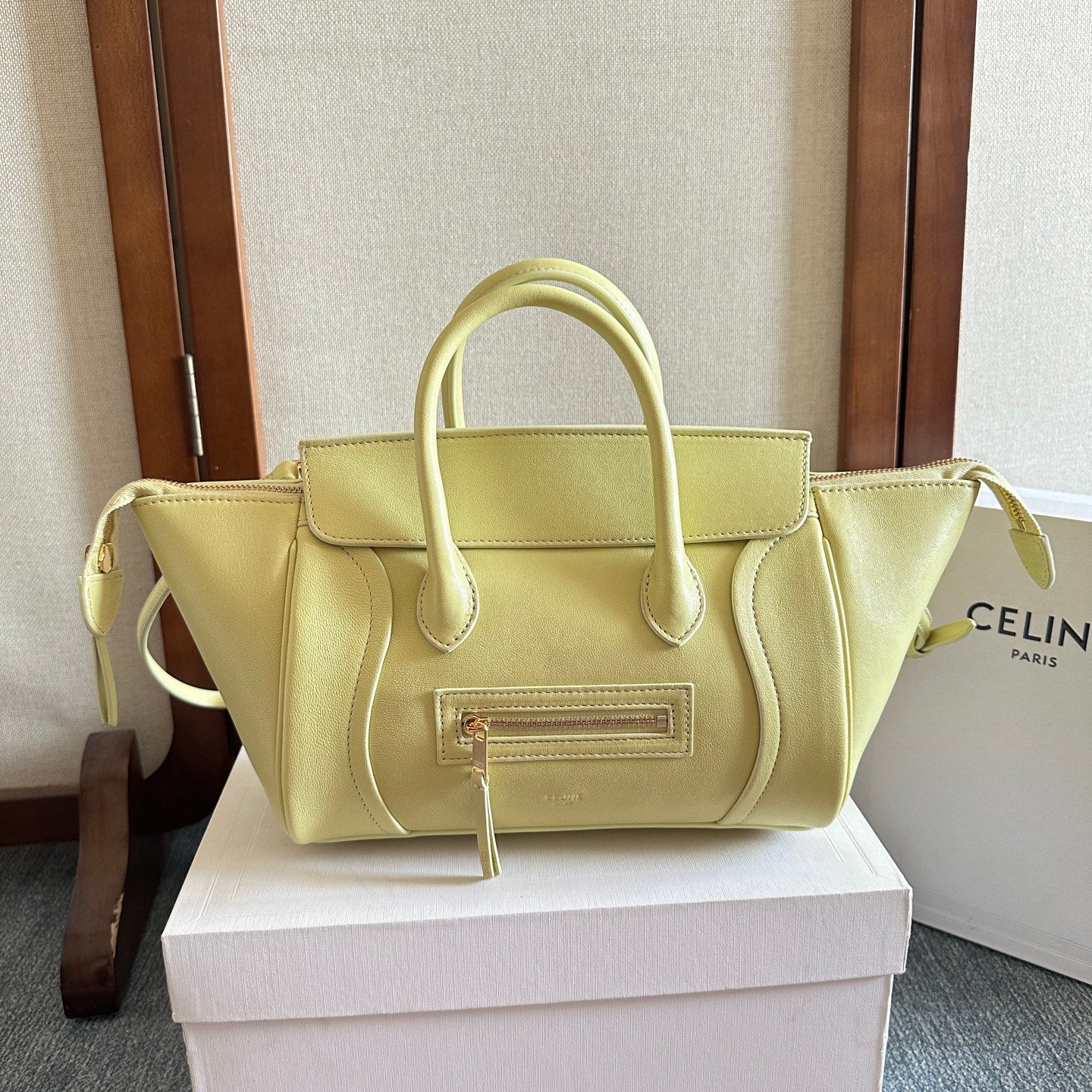 Light yellow Celine tote bag with double top handles and front zip pocket