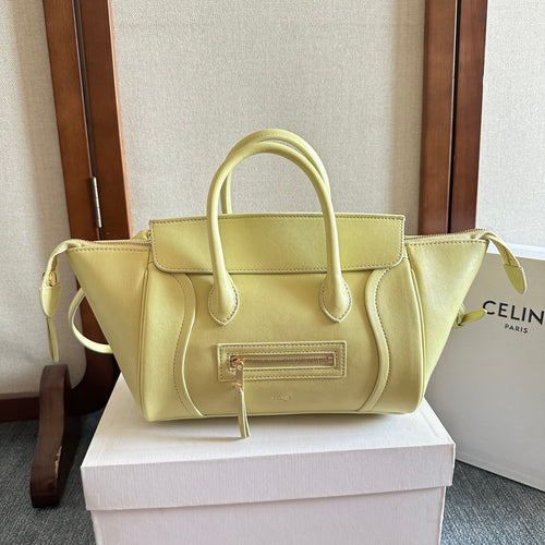 Light yellow Celine tote bag with double top handles and front zip pocket