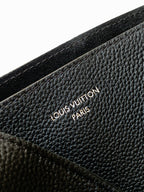 Black textured leather with embossed Louis Vuitton logo