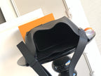 Black shoulder bag open at the top, showing dark interior