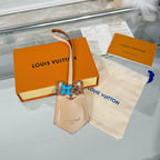 Louis Vuitton beige key pouch with blue cat face charm and leather wrist strap