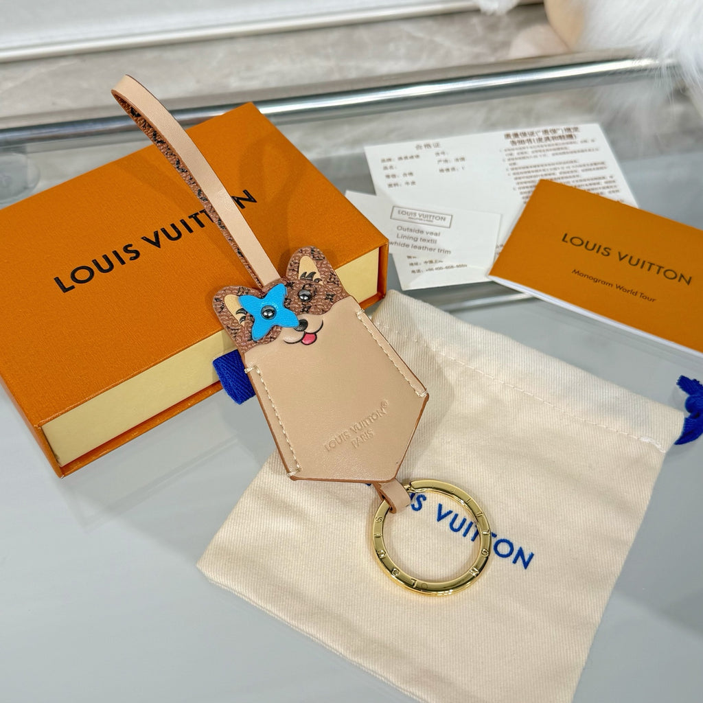 Louis Vuitton beige key pouch with cat face charm and round key ring attachment
