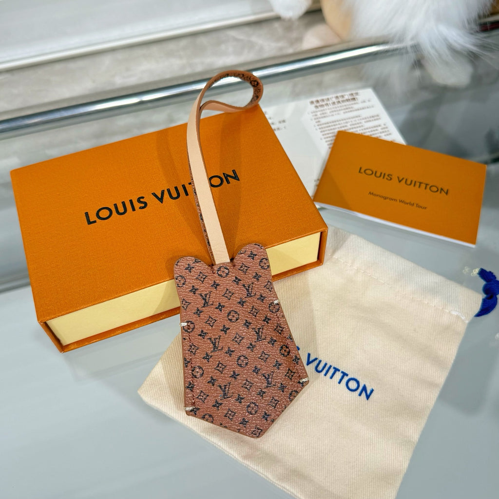 Louis Vuitton brown monogram key pouch with leather strap and blue tie detail