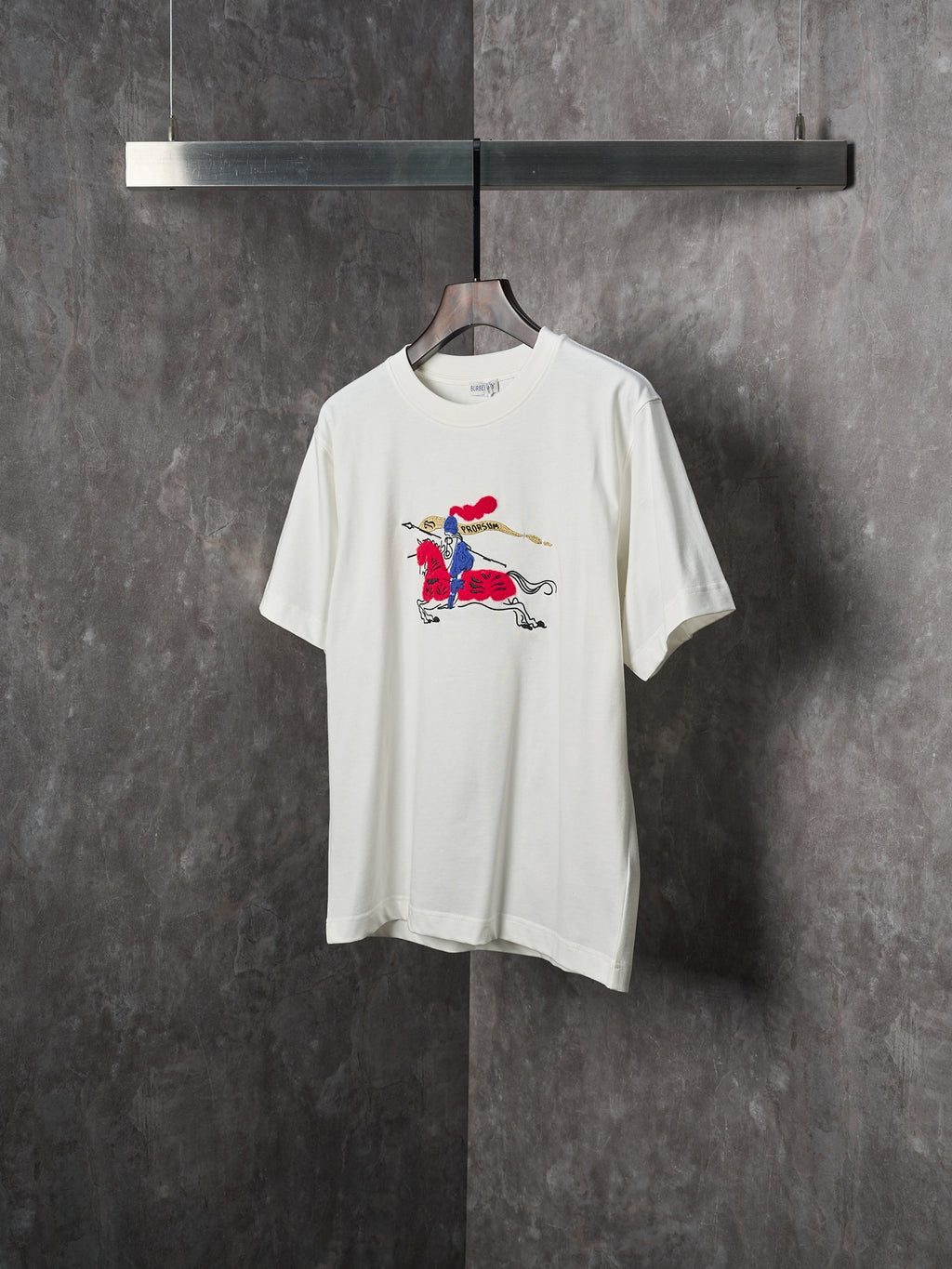 White short-sleeve T-shirt with colorful polo horse rider print