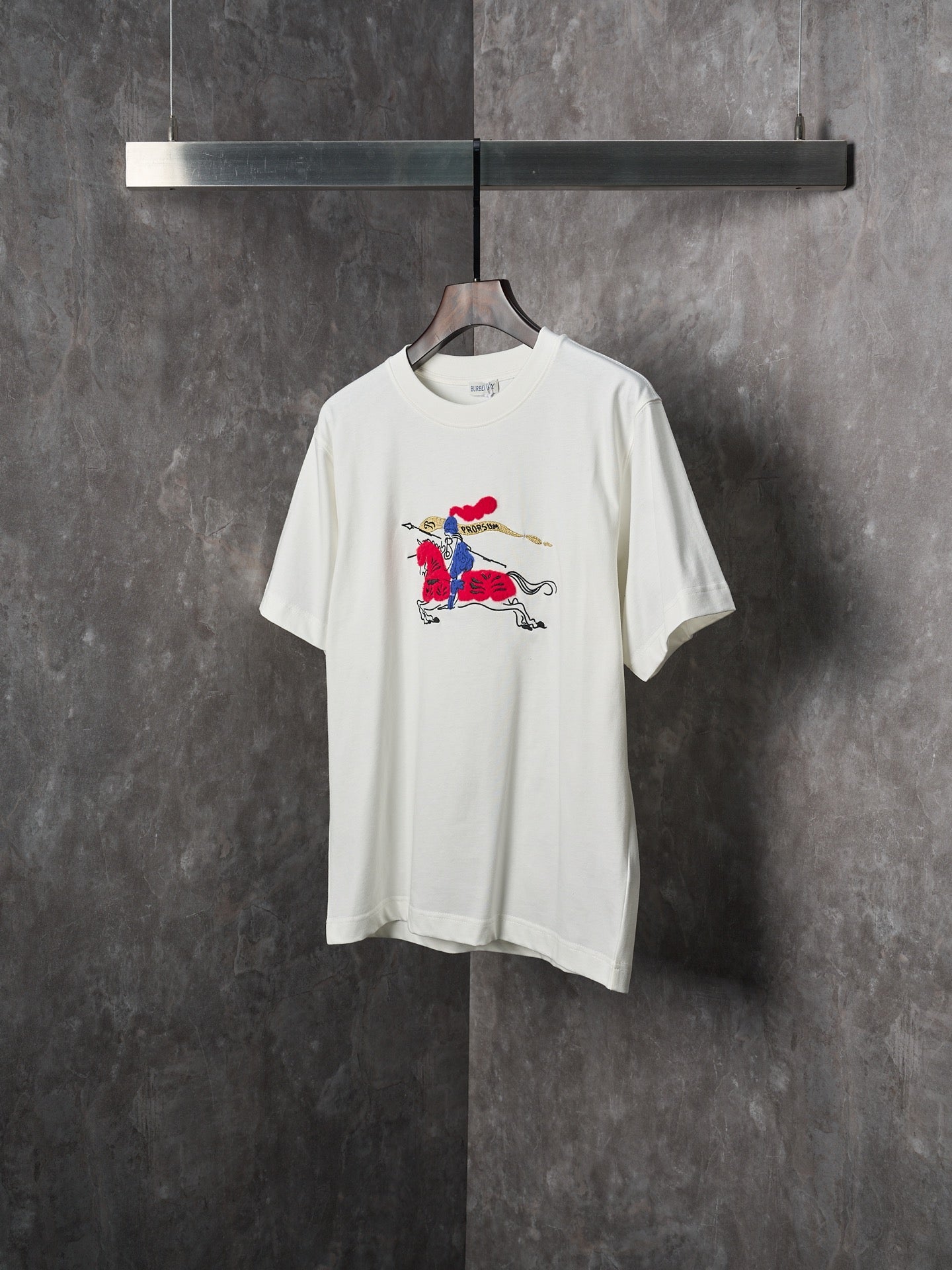 White short-sleeve T-shirt with colorful polo horse rider print
