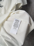 White T-shirt with fabric care label inside near neckline