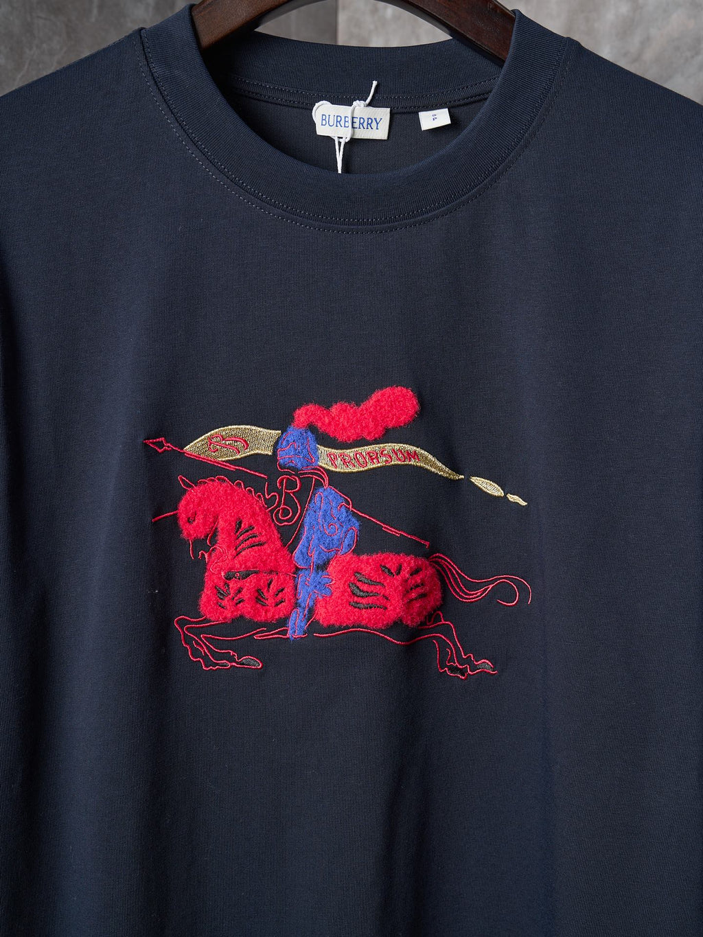 Navy crew-neck short-sleeve T-shirt with colorful animal rider graphic