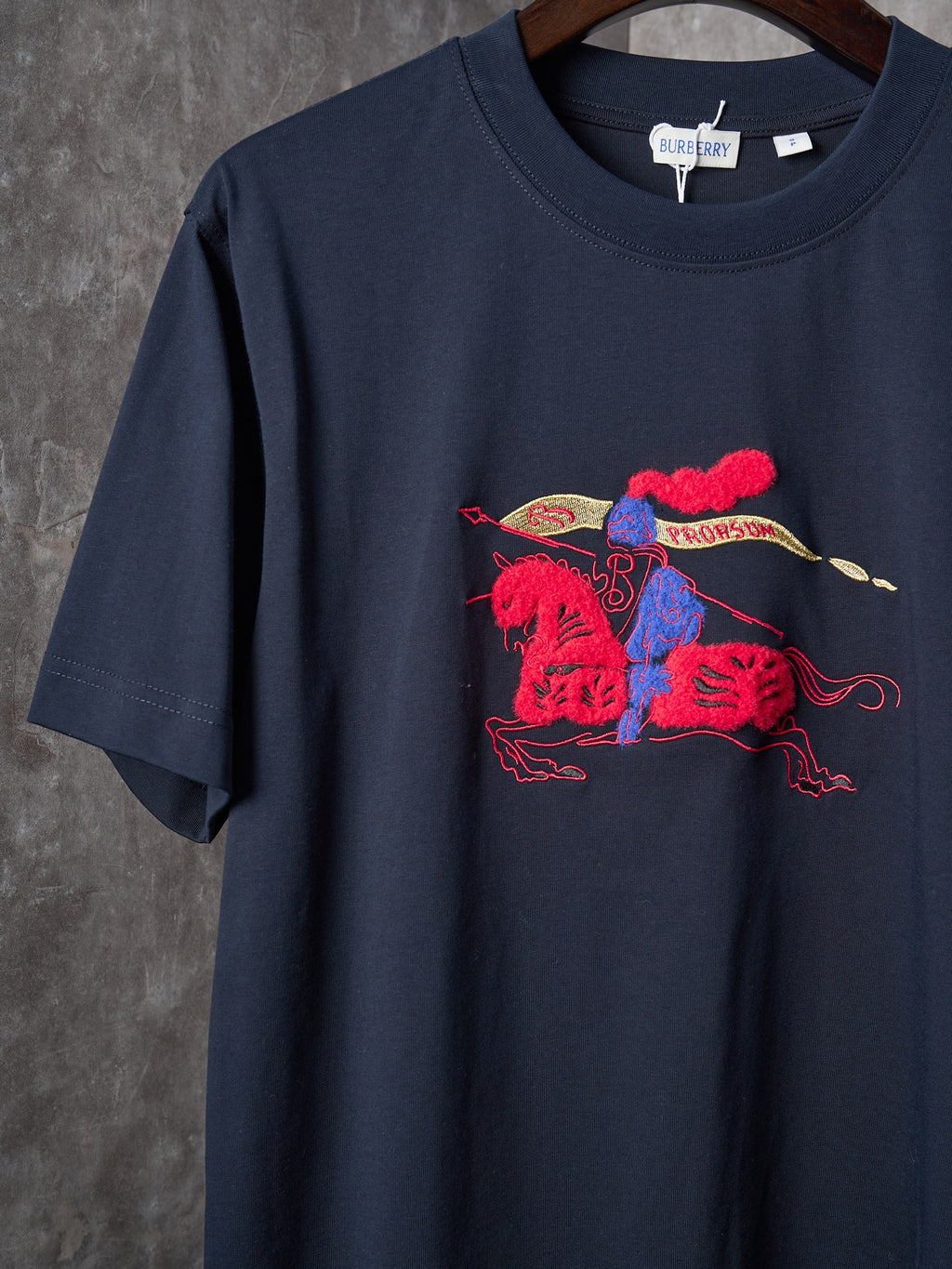 Navy crew-neck short-sleeve T-shirt with colorful graphic on the front