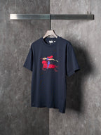 Navy crew-neck short-sleeve T-shirt with colorful graphic on the front