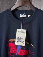 Navy crew-neck T-shirt with front graphic and “BURBERRY” neck tag