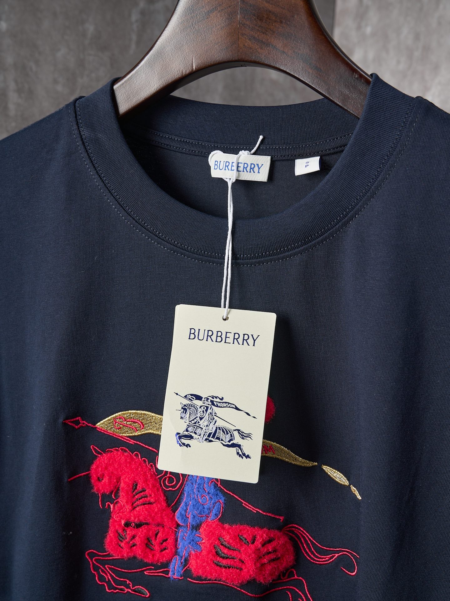 Navy crew-neck T-shirt with front graphic and “BURBERRY” neck tag