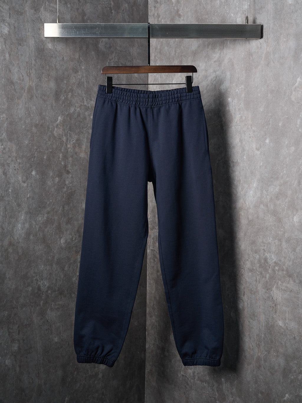 Navy jogger pants with elastic waistband and elastic cuffs