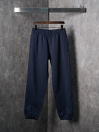 Navy jogger pants with elastic waistband and elastic cuffs