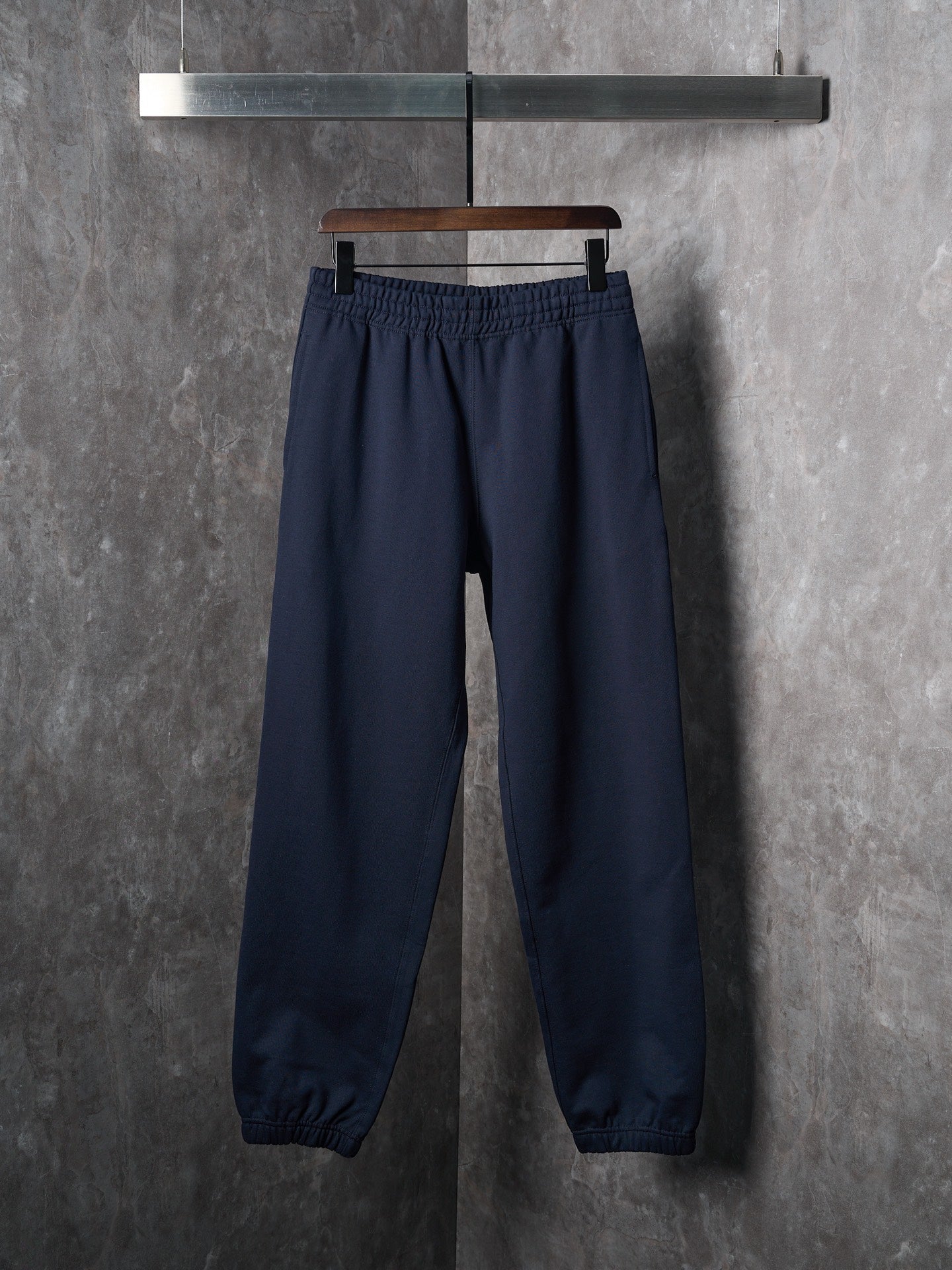 Navy jogger pants with elastic waistband and elastic cuffs