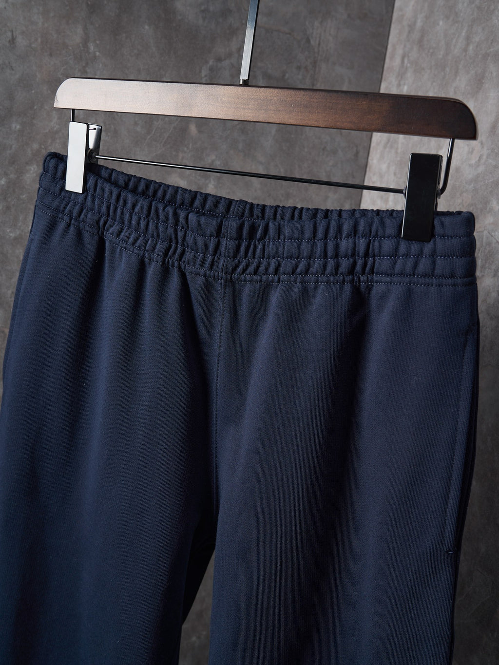 Navy pants with gathered elastic waistband and belt loops