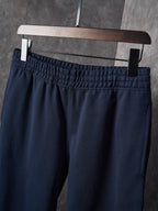 Navy pants with gathered elastic waistband and belt loops