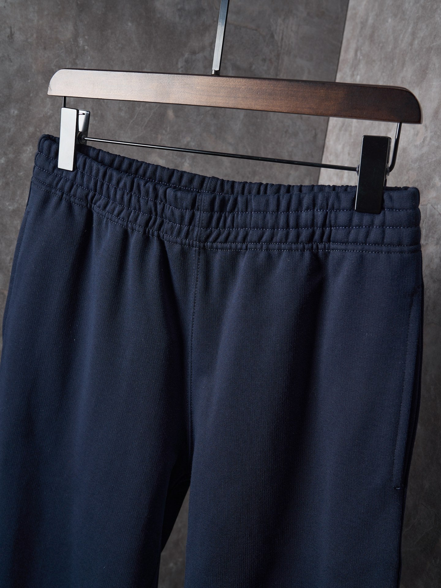 Navy pants with gathered elastic waistband and belt loops