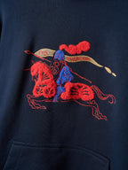 Navy hoodie front with large embroidered red and blue racing rider graphic