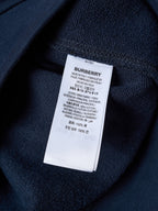 Navy hoodie interior care label with BURBERRY branding