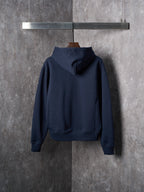 Navy pullover hoodie with attached hood and long sleeves