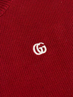 White GG logo on a red rib-knit sweater fabric