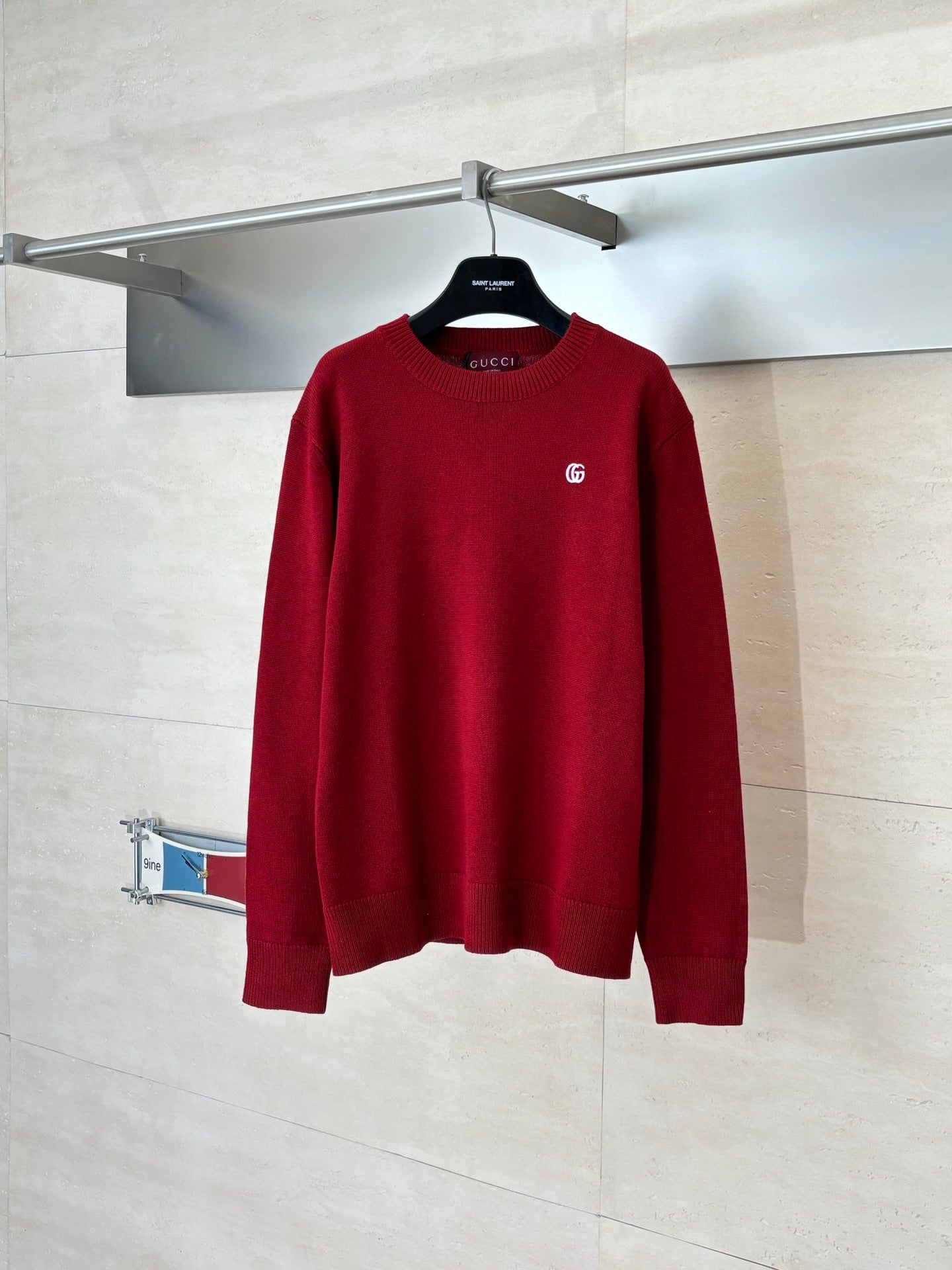 Red Gucci crewneck sweater with GG logo on the chest