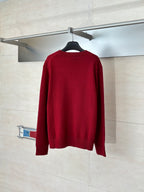 Back view of red Gucci crewneck sweater on a hanger