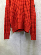Red long-sleeve knit sweater with crew neck and textured grid weave