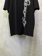 Black T-shirt front view with large white script logo across the chest