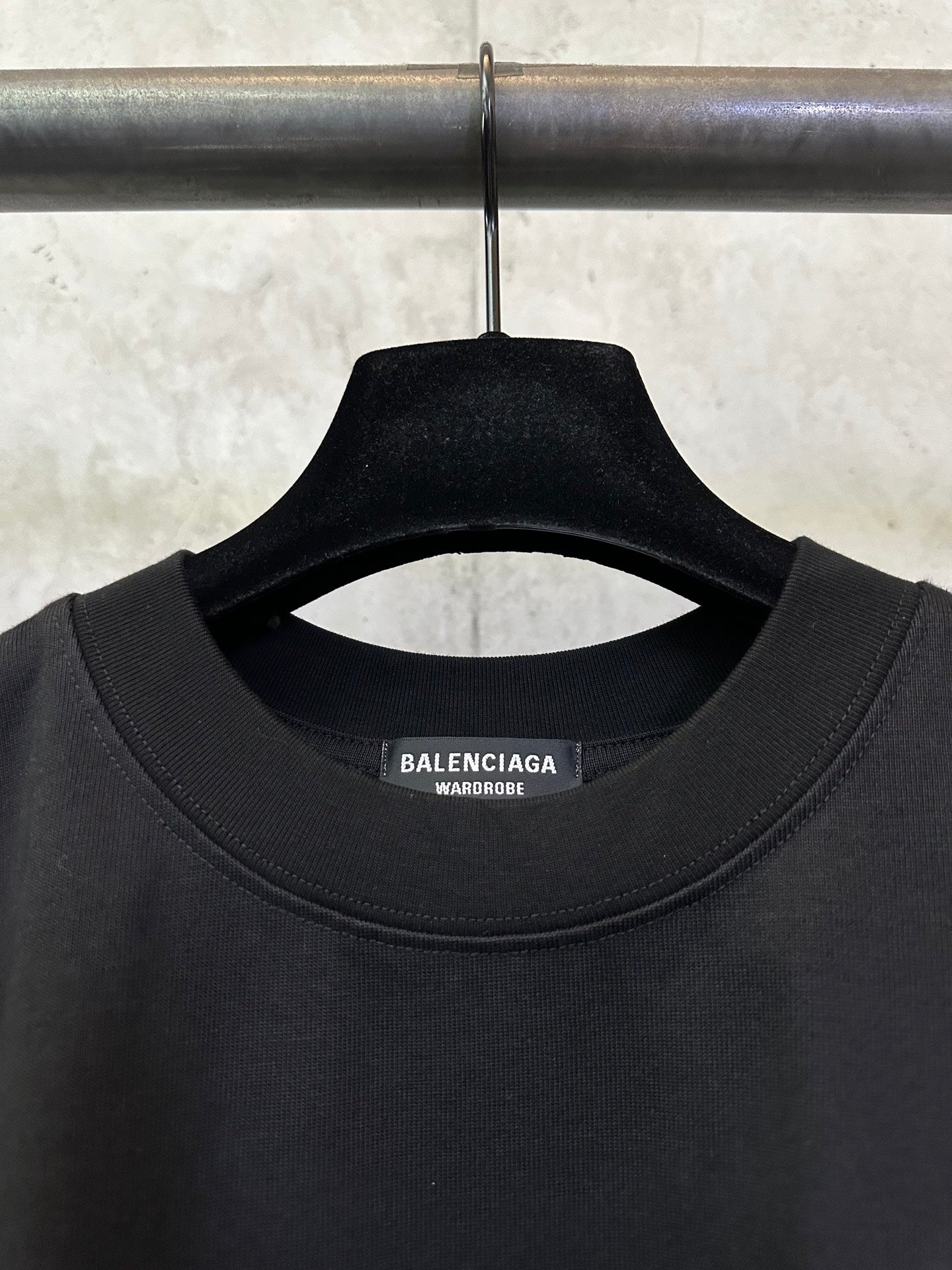 Black crew-neck T-shirt with BALENCIAGA neck label and ribbed collar