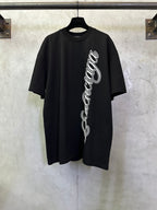 Black T-shirt with white script logo on the front, short sleeves, crew neck