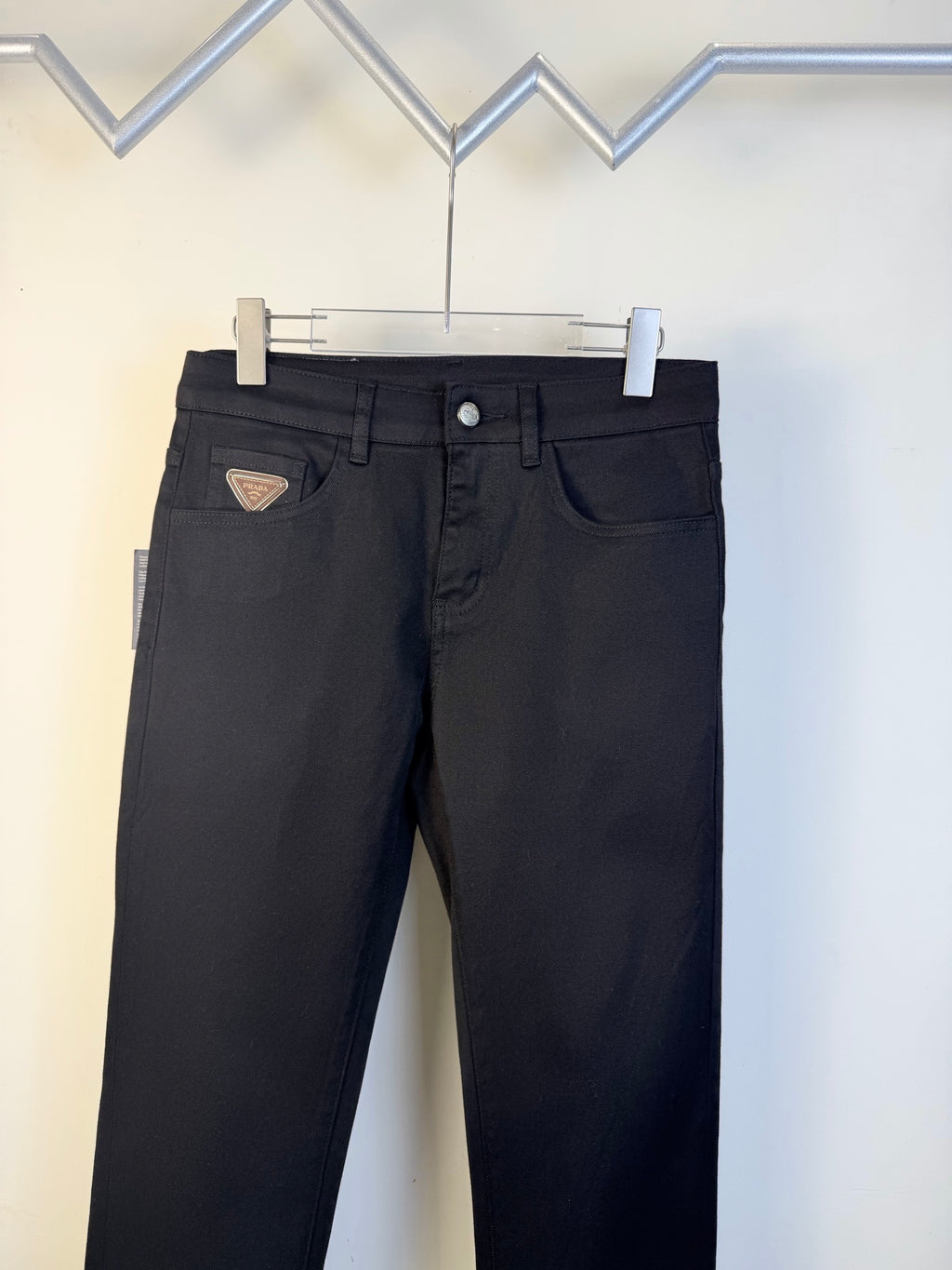 Prada dark blue pants with button fly and front pockets on hanger