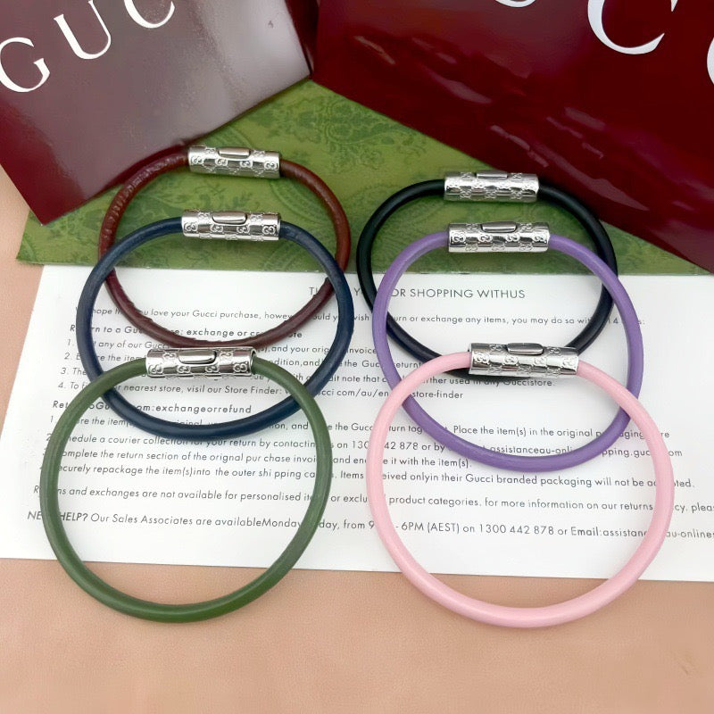 Gucci braided bracelets with logo bar clasp in dark green, navy, lavender, and pink